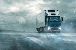 
Truck On Wet Road In Heavy Rain Under Cloudy Sky