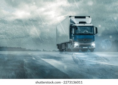 
				truck on wet road in heavy rain under cloudy sky