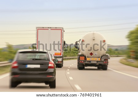 A truck in overtaking on a two-lane highway as a road obstacle