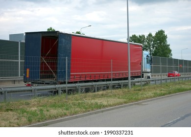 Truck Parked On The Road With An Open Trailer