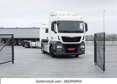 Truck in the parking lot of the car service. Service maintenance of trucks. Cargo transportation and logistics, car repair and inspection