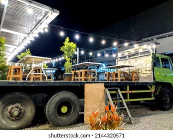 A Truck, With A Party In Its Back Bed. Lights, Tables, An Awning, Plants. A Restaurant Mounted On Top Of A Truck. External Event, Happening At Night. Bali, Indonesia. 01.11.2021