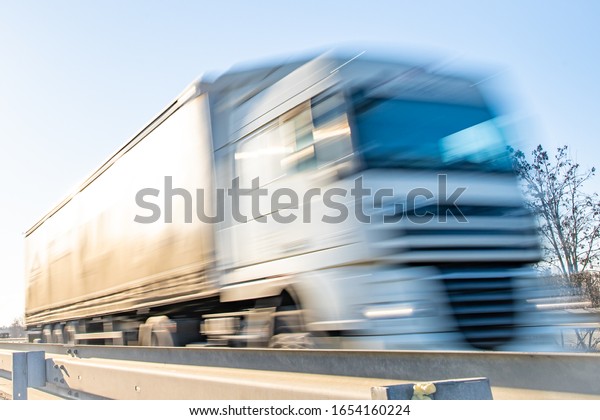 truck\
passing through a toll gate on a highway toll\
roads