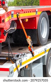 Truck platforms, reinforced anchorage with a ratchet fixing strap to connect an anchorage point on the truck floor. Vertical image, selective focus. - Shutterstock ID 2079257035