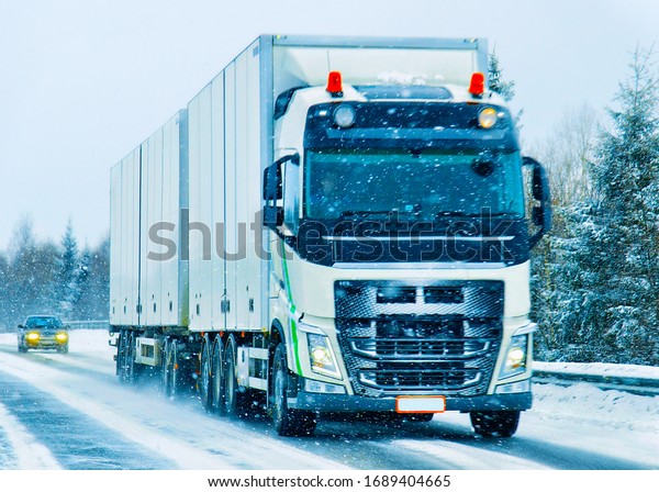 Truck\
in the road in winter Rovaniemi, Lapland,\
Finland