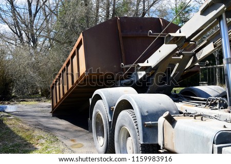 Truck roll-off dumpster