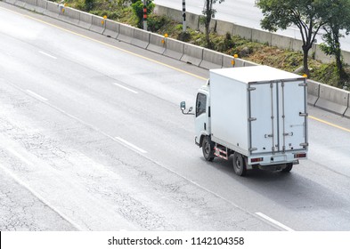 Truck Running On The Road, Small Truck On The Road.