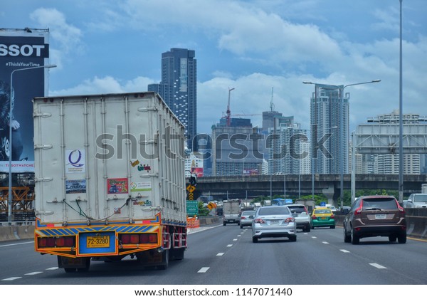 A truck is running on a street in Bangkok, thailand,\
July 2018