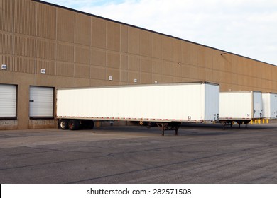 Truck Semi Trailers Waiting To Be Unloaded At A Warehouse Or Factory.
 