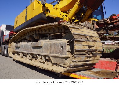  A Truck With A Special Semi-trailer For Transporting Oversized Loads. Transport Of A Huge Bulldozer.