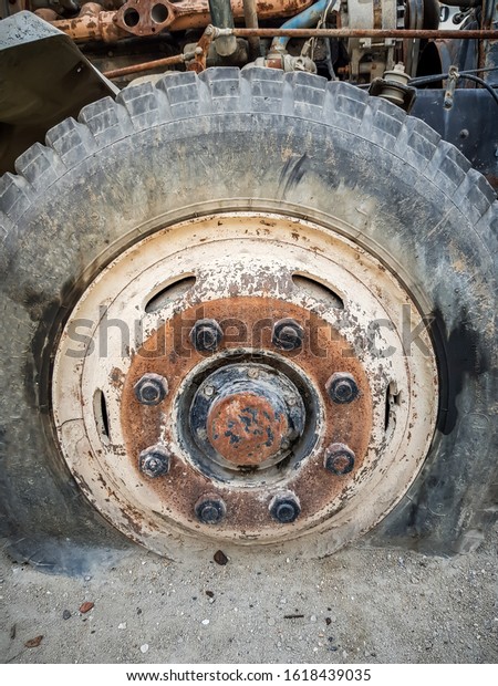 Truck stands with a broken
wheel