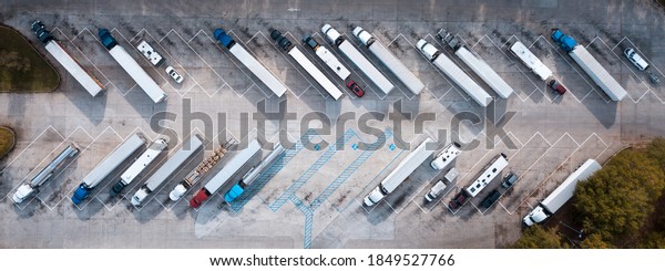 Truck stop on Rest area On the highway. Top\
view car parking lot. Truck Driver company. View from the bird\'s\
flight. Aerial photography. Copy\
space.