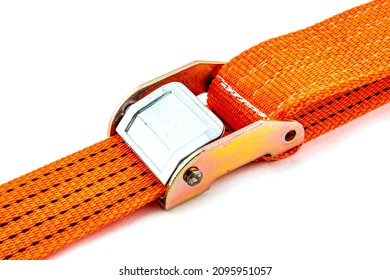 Truck strap lock in orange nylon and metal tie isolated over white background. Ratchet straps for cargo load control. Cargo restraint strap