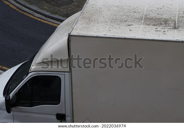 Truck in the street seen\
from above