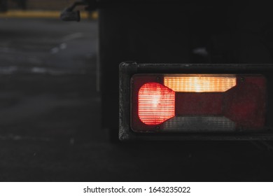 Truck Tail Lights On. Flashing Turn And Stop Signal. Closeup Photo. Car Alarm. Vehicle Broke Down Concept Photo.