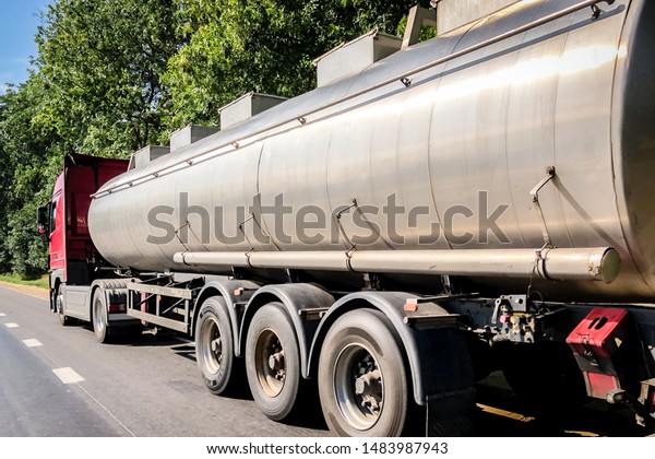 Truck with tank on the\
road.