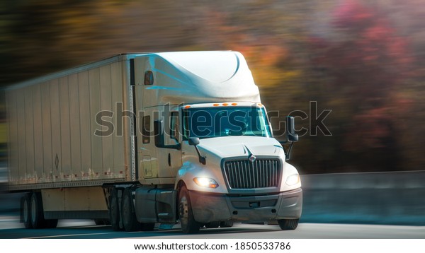 Truck with trailer\
on highway. Truck Driver company. Trucking jobs. Copy space.\
Chicago, USA - November 1,\
2020