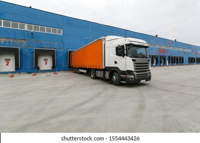 truck with a trailer at the warehouse