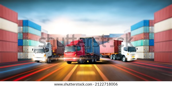Truck\
transport with red and blue container on highway at port cargo\
shipping dock yard background, logistics import export and\
transportation industry concept, depth blur\
effect
