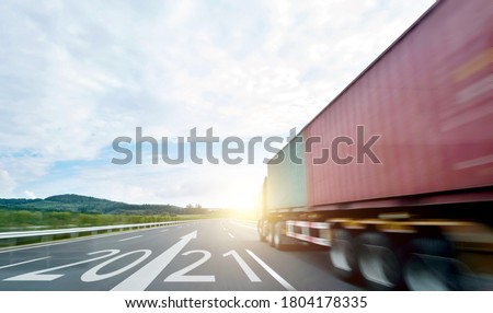 Truck transportation on high road with number 2021