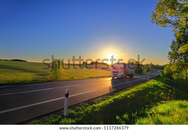 Truck transportation
on the road at sunset