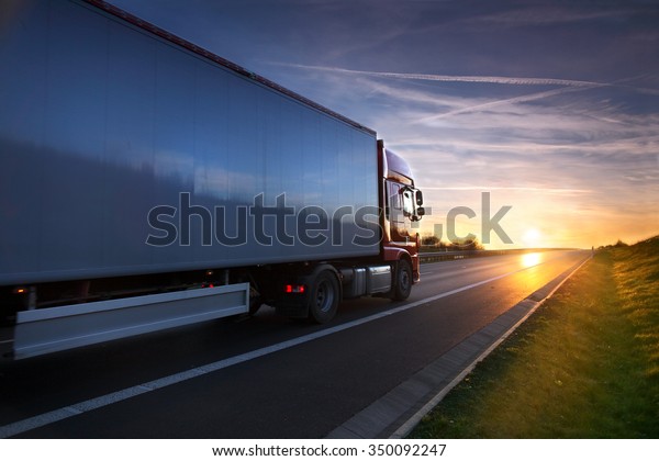 Truck transportation\
on the road at sunset