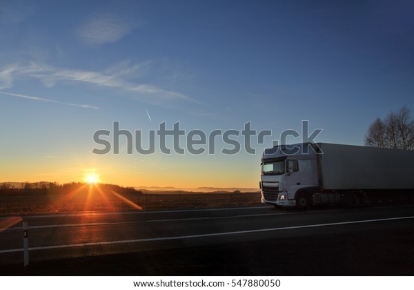Truck transportation at\
sunset