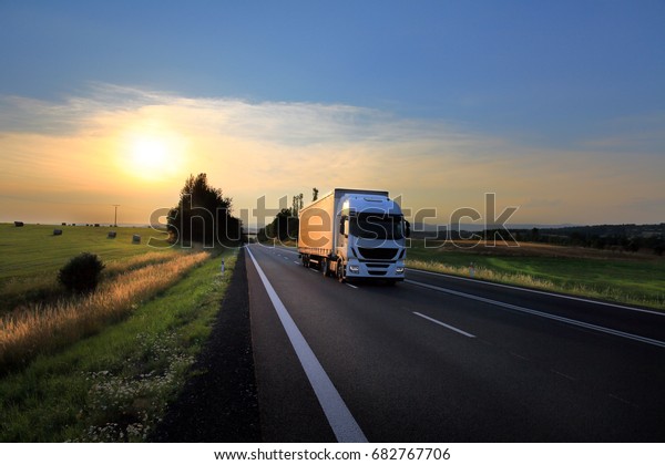 Truck transportation at\
sunset
