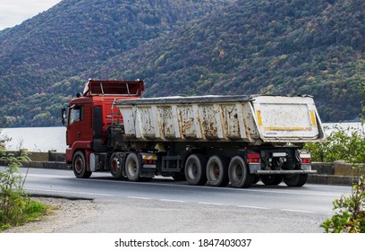 Truck Transporting Various Construction Materials. Industrial Truck On The Road