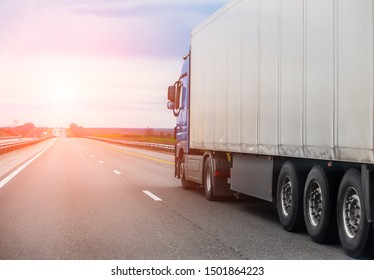 truck transports freight on  country highway