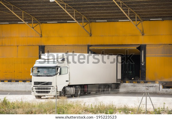 Truck at warehouse\
building