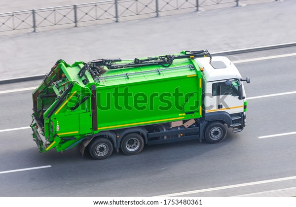 Truck for waste collection in residential areas of
the city rides on the
road
