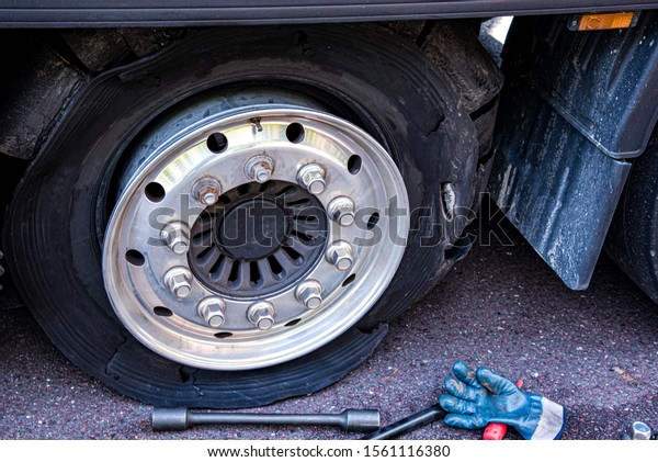 Truck\
wheel. Repair of cars on the road. Change\
wheel