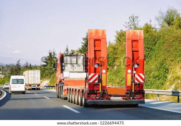 Truck wihout trailer box at the highway\
asphalt road of Poland. Truck\
transporter