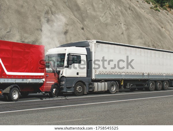 Trucks accident. Road accident. Two trucks collided\
head-on. 