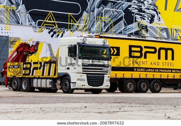 Trucks are carrying cargo. Background with copy\
space for text or inscriptions. Illustrative editorial. May 25,\
2021 Balti Moldova.