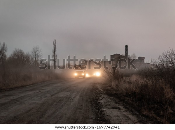 Trucks\
light in the huge dust, smog. Industrial\
theme