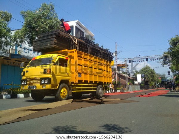 trucks\
load iron fences, for the preparation of events in the Temanggung\
Regency, Central Java, Indonesia. Nov 16,\
2019