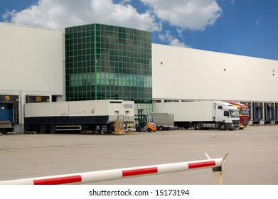 Trucks Loading At A Warehouse Or Distribution Center