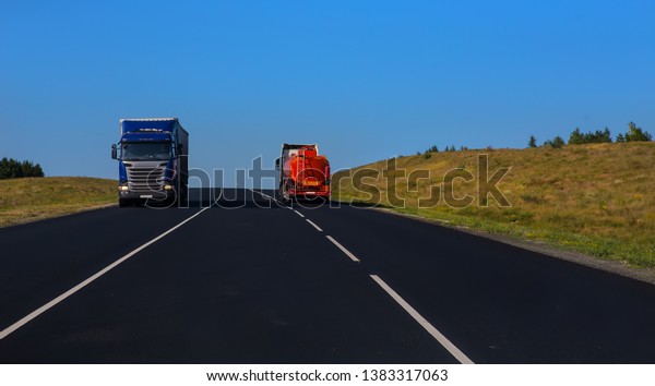 Trucks moving on a country\
highway