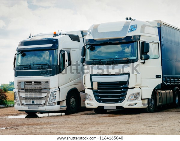 Trucks on the road in Poland. Lorry transport\
delivering some freight\
cargo.