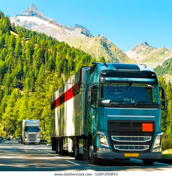 Trucks on the\
road at Visp, Valais canton,\
Swiss.
