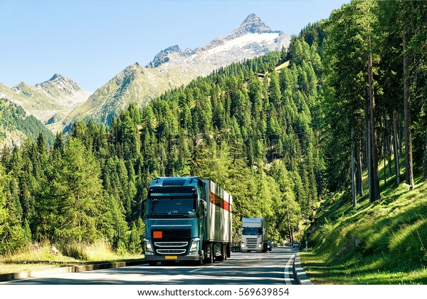Trucks on the\
road in Visp, Valais canton,\
Swiss.