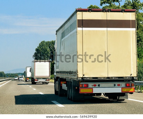 Trucks on the roadway in\
Switzerland