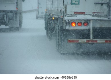 Trucks on winter highway during snowstorm,   Oregon, Pacific Northwest