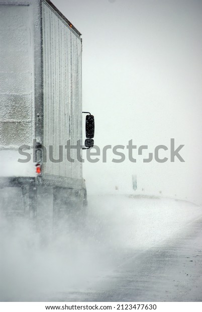 Trucks on winter highway during snowstorm,  \
Oregon, Pacific\
Northwest
