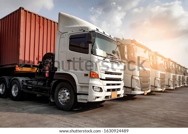 Trucks\
parked lined up, Road freight industry transport. Road freight\
industry cargo service, Logistics and transport\
