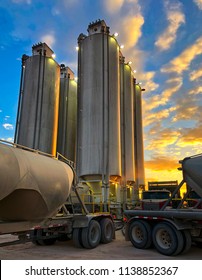 Trucks Pumping Sand Into Silos.