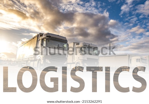 Trucks in a row with\
containers in the parking lot. Logistic and Transport concept with\
the word logistics