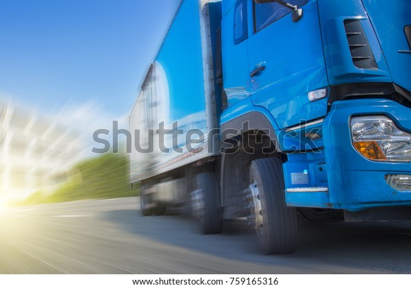 Trucks speeding along the\
road